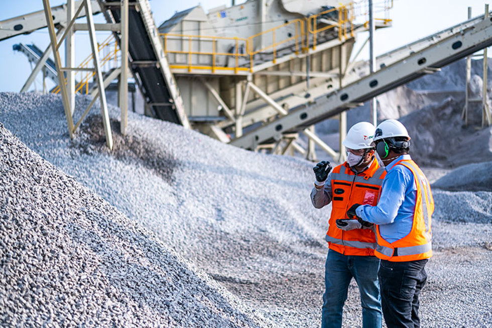 Two men at a quarry producing artificial sand.