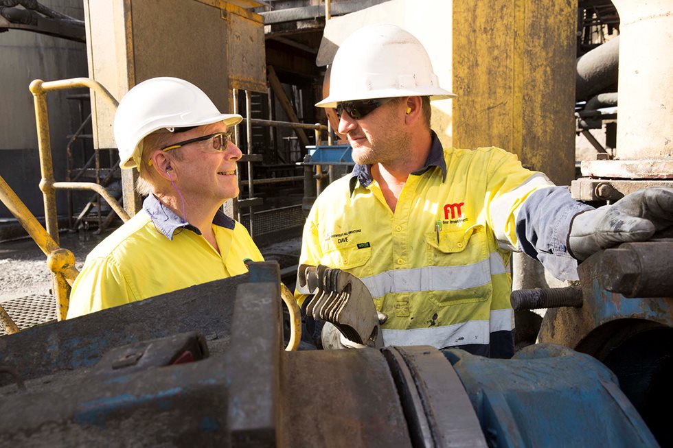 Two employees discussing at Greenfields Mill's mine.